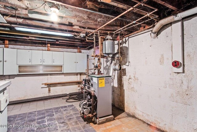 utility room featuring a heating unit