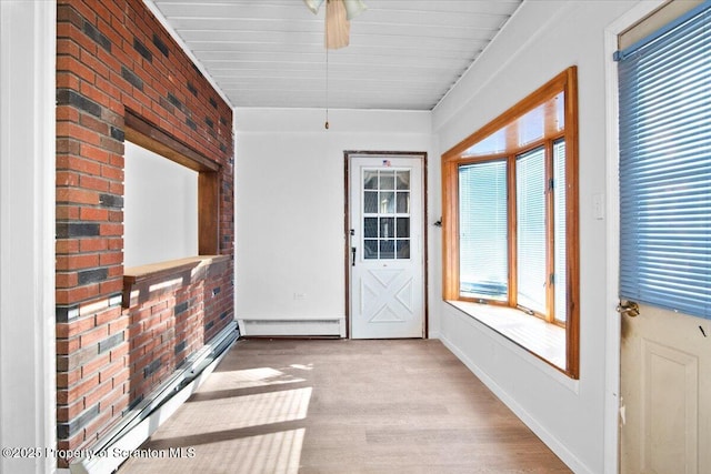 interior space featuring ceiling fan and a baseboard radiator