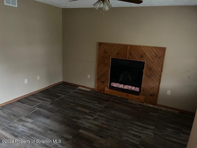 unfurnished living room featuring a textured ceiling and ceiling fan