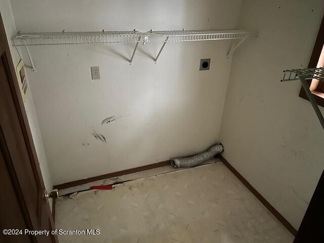 clothes washing area featuring electric dryer hookup