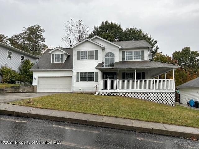 814 Laurel Creek Dr, Dickson City, PA 18519 - view of front of property featuring a front yard, a porch, and a garage