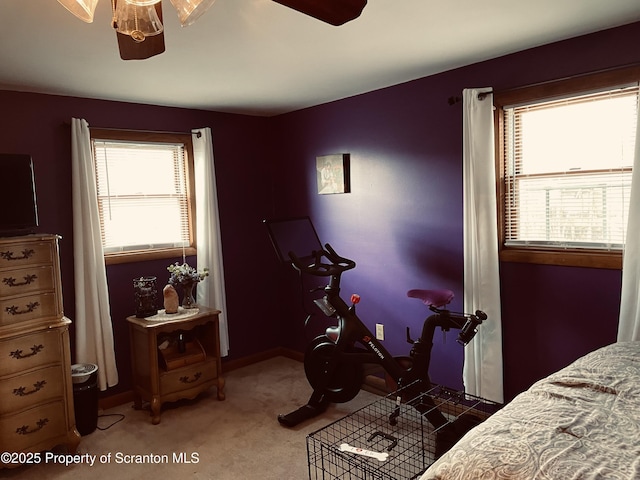 bedroom featuring carpet and baseboards