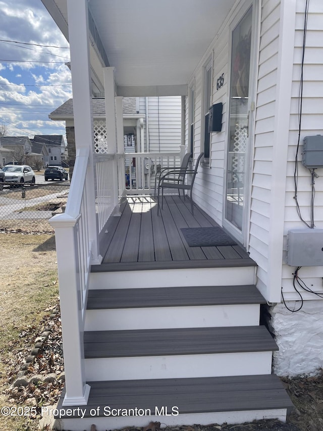 wooden terrace featuring a porch