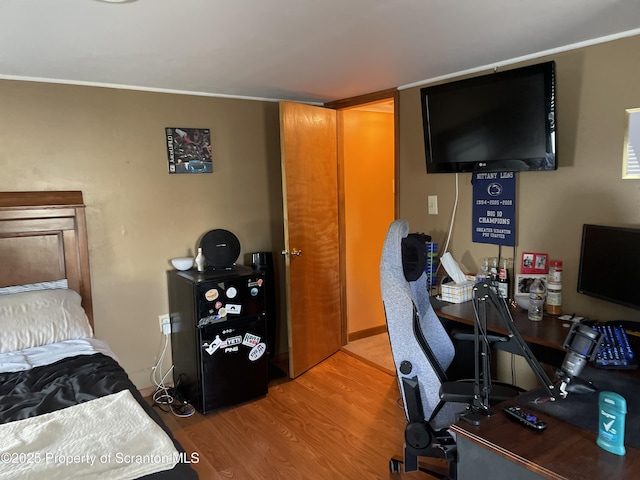 bedroom with wood finished floors