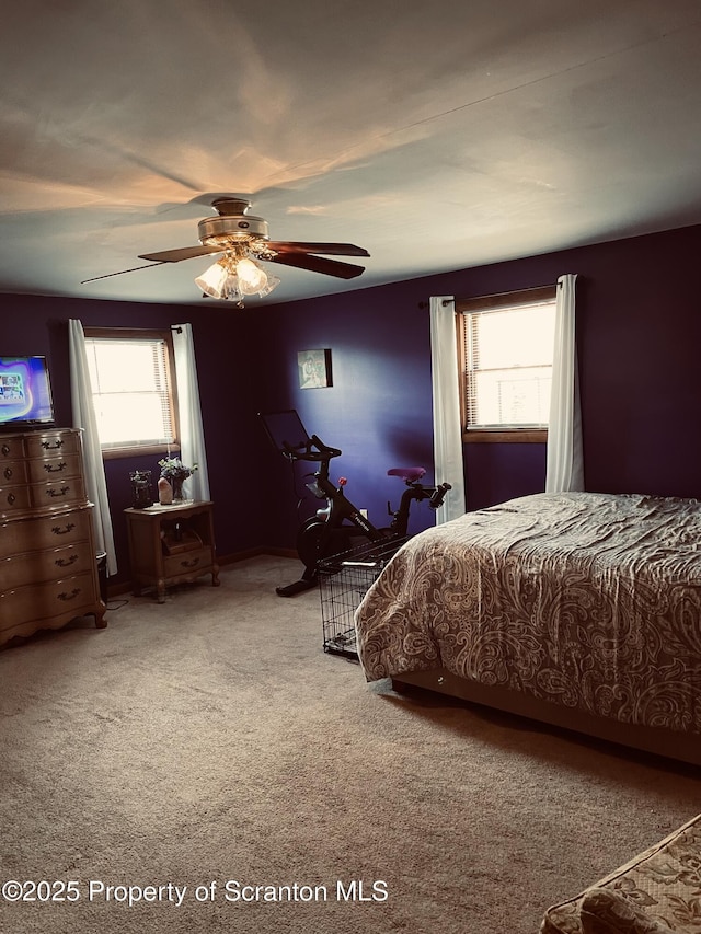 bedroom with carpet floors and a ceiling fan