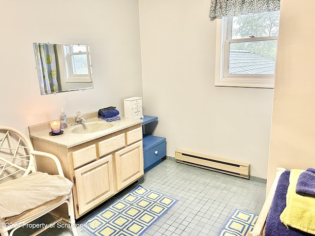 bathroom featuring tile patterned flooring, vanity, and a baseboard radiator