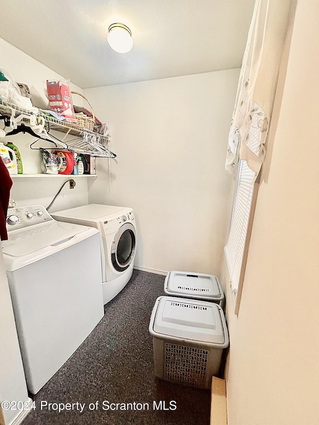 clothes washing area featuring washing machine and clothes dryer