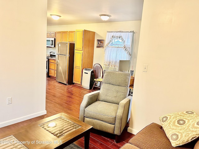 sitting room with dark hardwood / wood-style floors