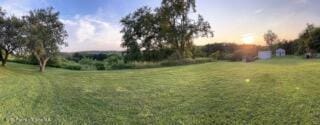 view of yard at dusk