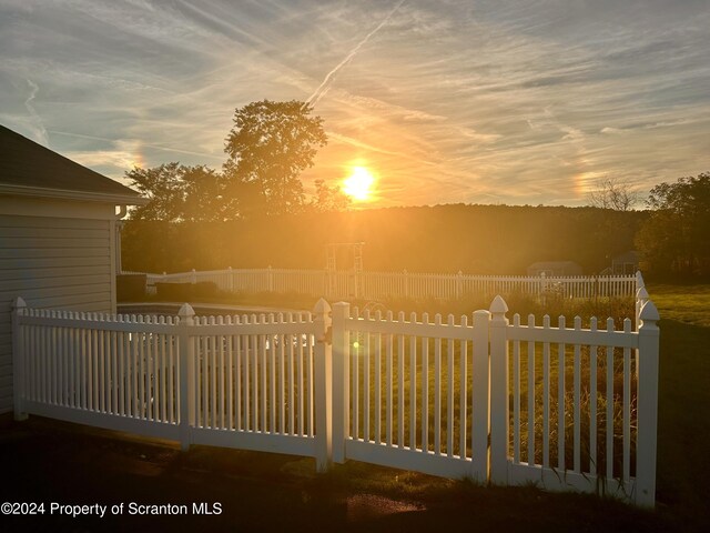 view of gate at dusk