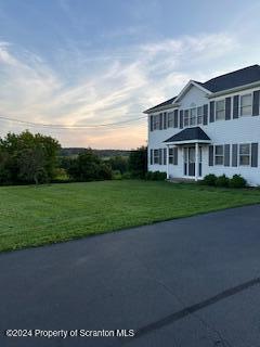 view of front of property with a lawn