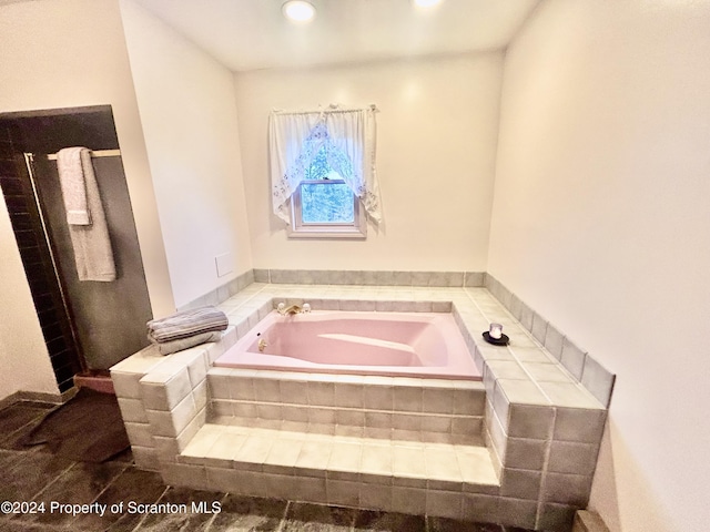 bathroom with tiled bath