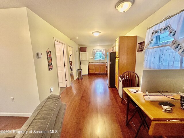 home office featuring dark hardwood / wood-style flooring and sink