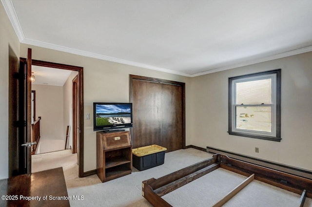 bedroom with light carpet, a baseboard radiator, ornamental molding, and a closet