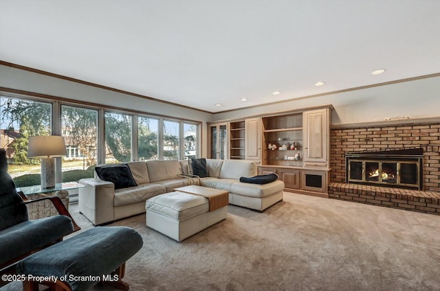 carpeted living room with crown molding and a fireplace