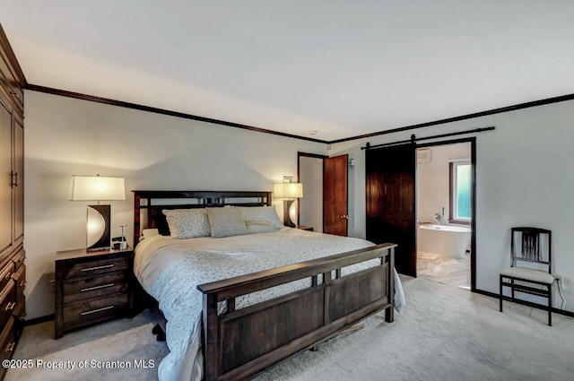 carpeted bedroom with ornamental molding, a barn door, and connected bathroom