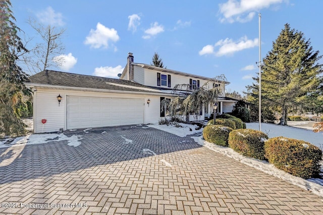 front of property featuring a garage