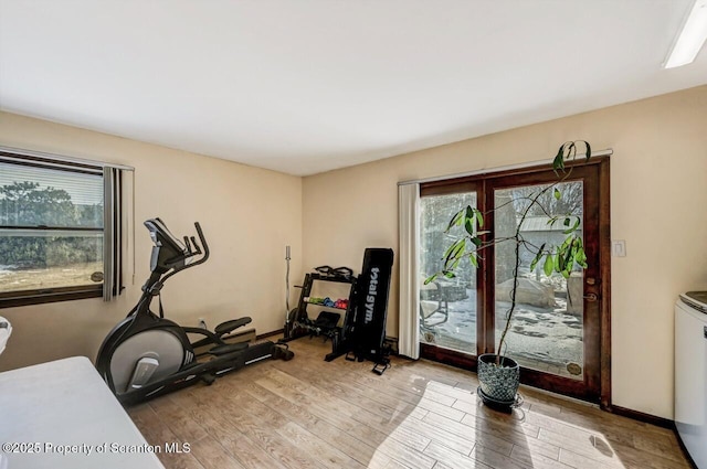 exercise area featuring light hardwood / wood-style floors