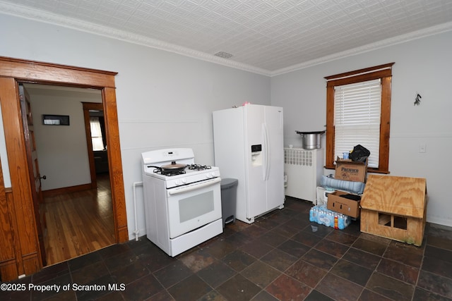 kitchen with visible vents, ornamental molding, stone finish floor, an ornate ceiling, and white appliances