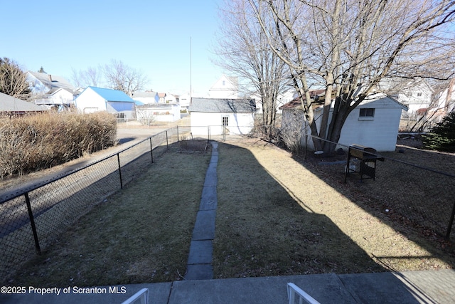 view of yard with a residential view and a fenced backyard