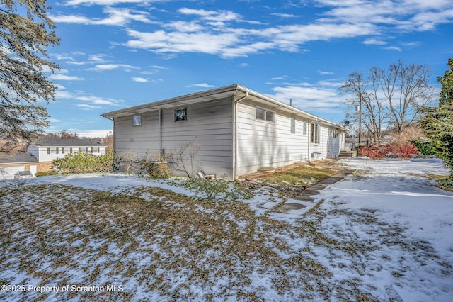 view of snow covered property