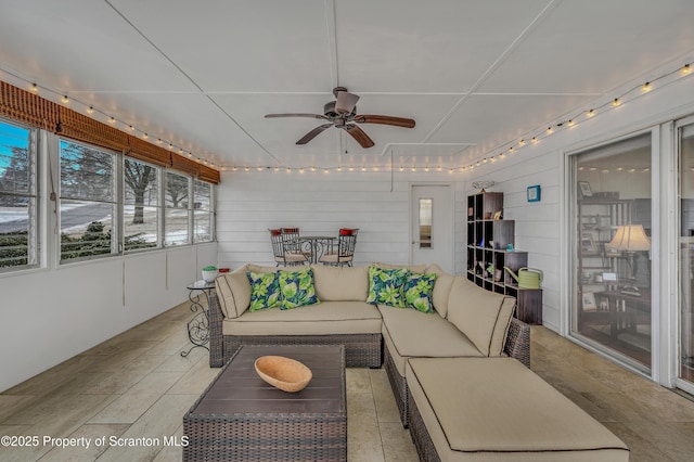 sunroom / solarium with ceiling fan