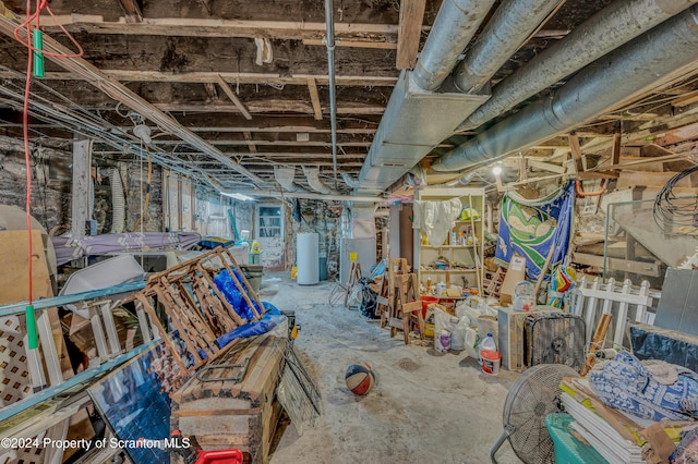 basement featuring gas water heater