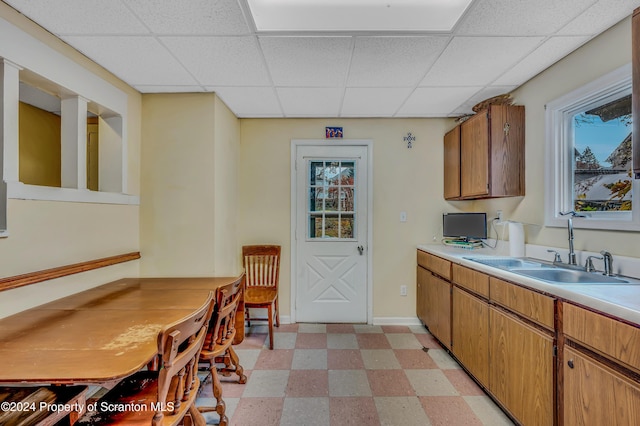 kitchen featuring sink and a drop ceiling