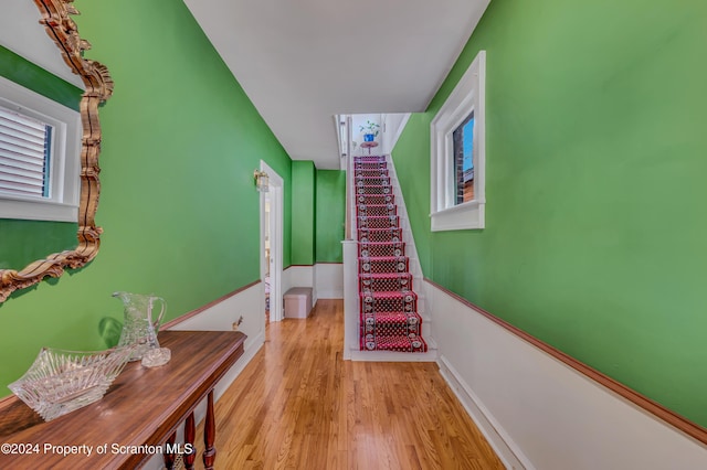 stairs with wood-type flooring