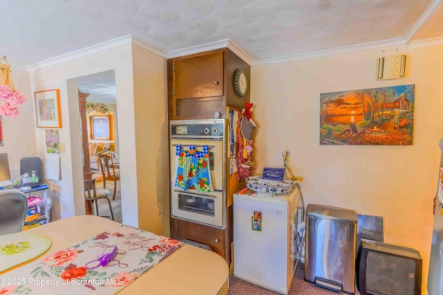 kitchen featuring ornamental molding and double oven