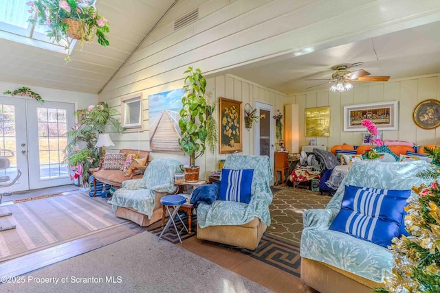 sunroom featuring lofted ceiling, french doors, and ceiling fan