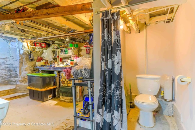 bathroom featuring toilet and concrete floors