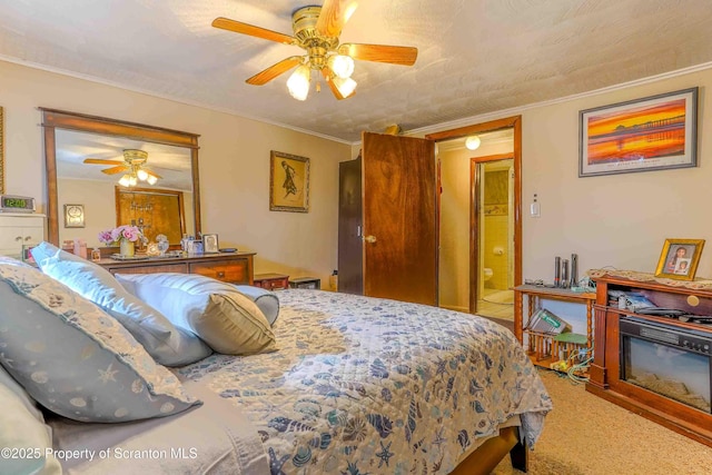 bedroom with crown molding, carpet flooring, and ceiling fan