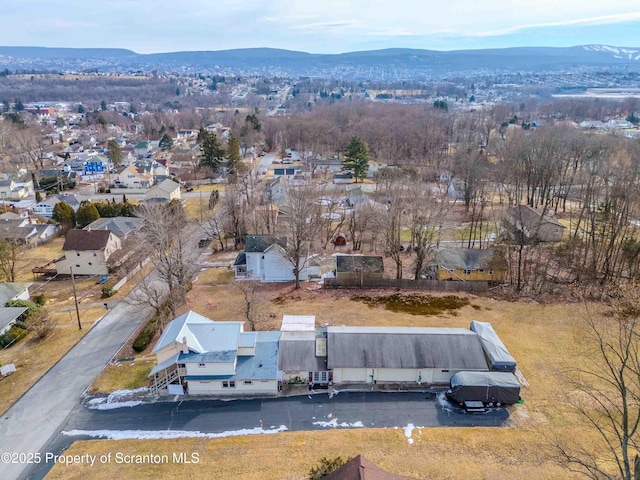 drone / aerial view featuring a mountain view