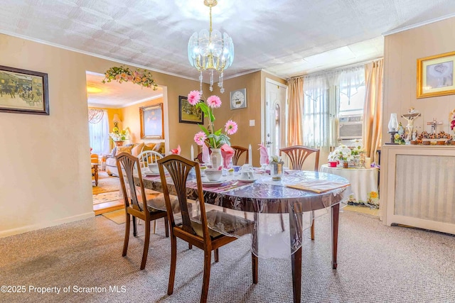 carpeted dining area with crown molding and plenty of natural light