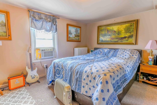 carpeted bedroom with radiator and cooling unit