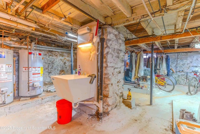 basement featuring water heater and sink