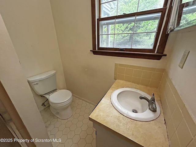 203 Willow Rd, Dalton, PA 18414 - half bathroom with vanity, toilet, and tile patterned flooring