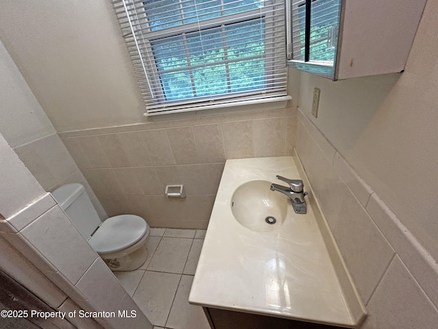 203 Willow Rd, Dalton, PA 18414 - half bath featuring tile walls, tile patterned flooring, toilet, vanity, and wainscoting