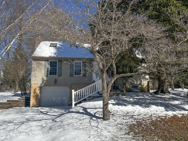 203 Willow Rd, Dalton, PA 18414 - view of front of house with a garage, stairway, and driveway