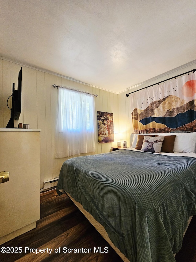 55 Lyman Ln, Gouldsboro, PA 18424 - bedroom with baseboard heating and wood finished floors