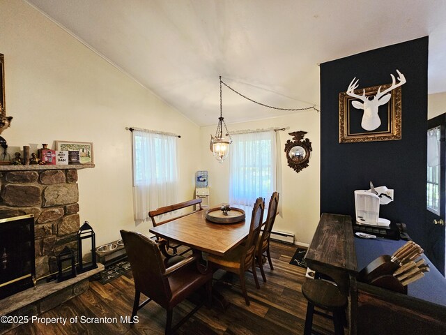 55 Lyman Ln, Gouldsboro, PA 18424 - dining space with dark wood finished floors, lofted ceiling, a chandelier, a fireplace, and baseboard heating