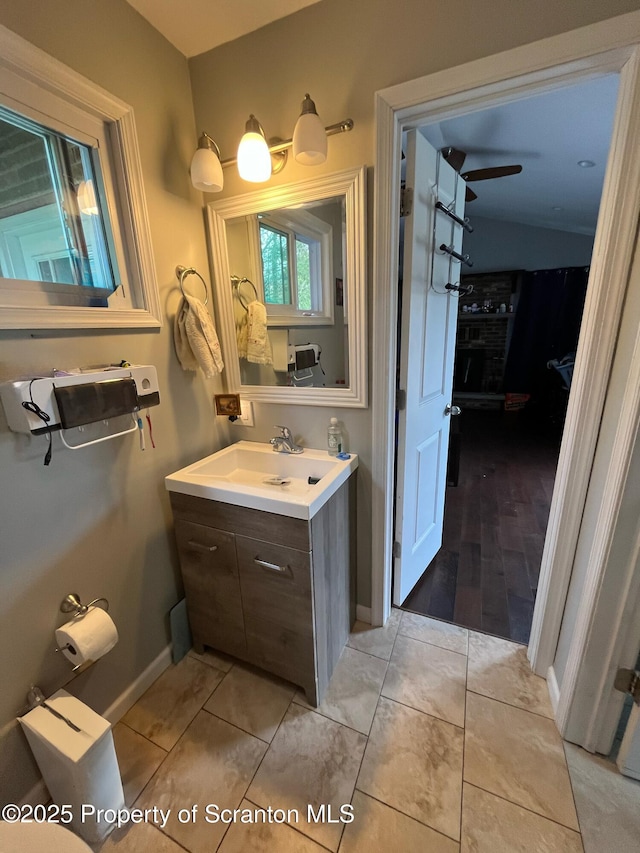 bathroom featuring vanity and baseboards