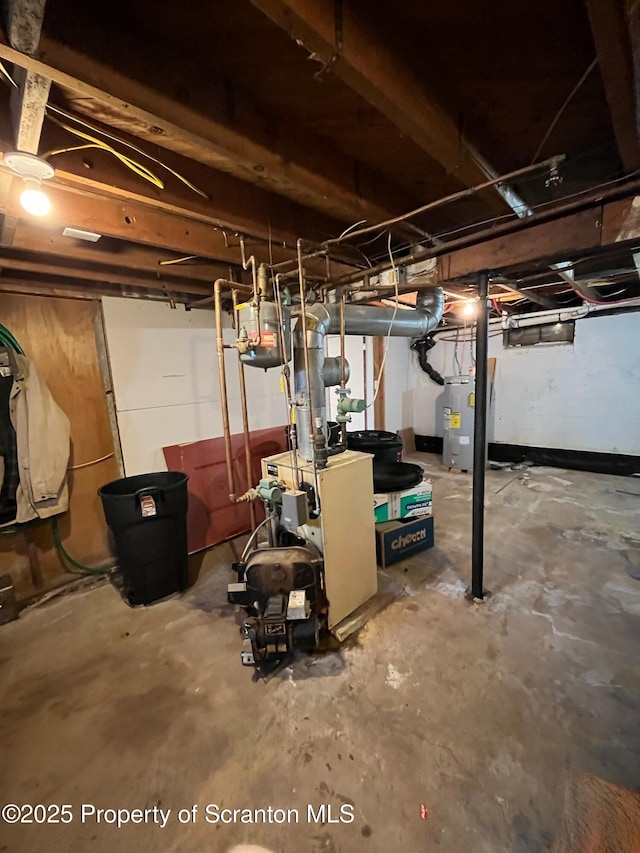 unfinished basement with electric water heater and a heating unit
