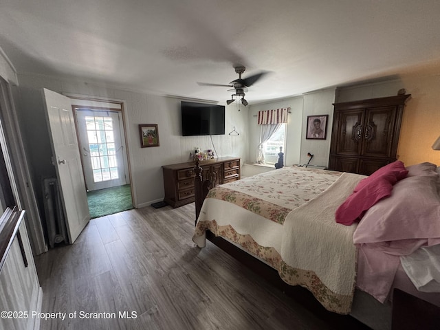 335 Railroad Ave, Scranton, PA 18505 - bedroom featuring wood finished floors, multiple windows, a ceiling fan, and access to outside