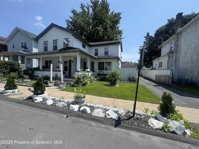 335 Railroad Ave, Scranton, PA 18505 - view of front facade with stucco siding and a porch
