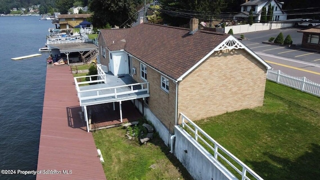 drone / aerial view featuring a water view