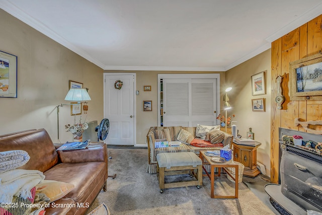 carpeted living area with ornamental molding