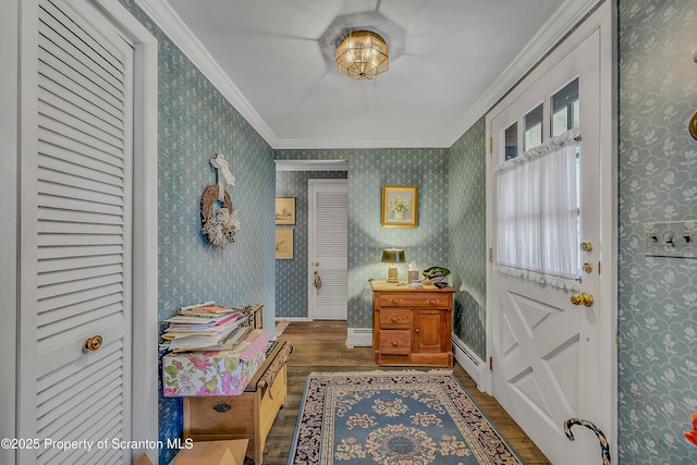 foyer featuring wood finished floors, crown molding, a baseboard radiator, and wallpapered walls