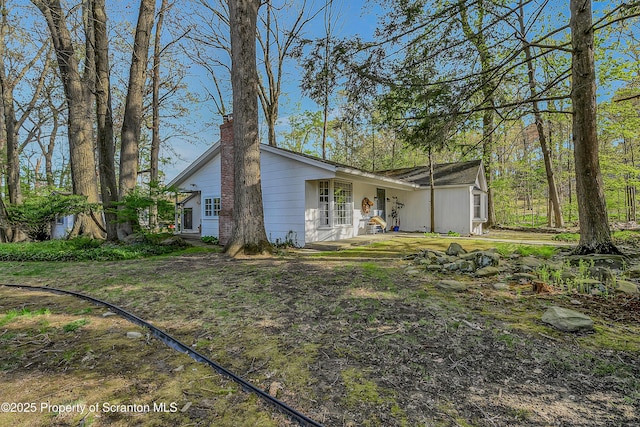 view of front of home with a chimney